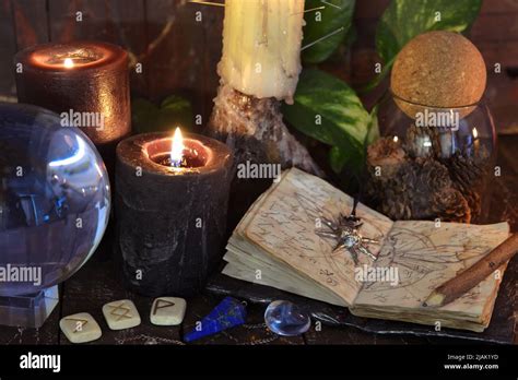 Wicca, esoteric and occult still life with vintage magic objects on witch table altar for mystic ...