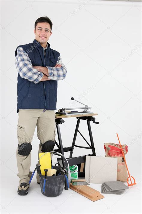 Tradesman posing with his tools and building materials — Stock Photo ...