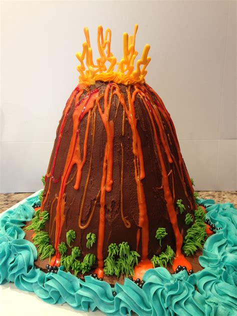 Chocolate Volcano cake with whites chocolate flames and stuffed with orange Sixlets (as lava ...