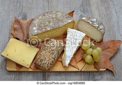 French cheese platter. Tray different french cheeses on a wooden tray. | CanStock