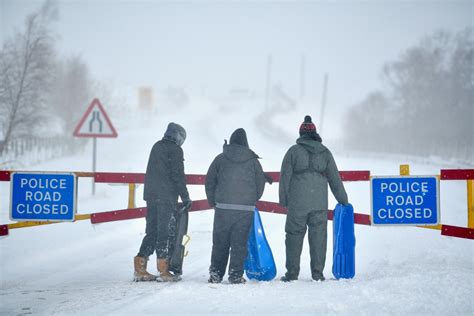 Snow gates close down busy Aberdeenshire road as Scots rage that 'summer isn't even over yet'