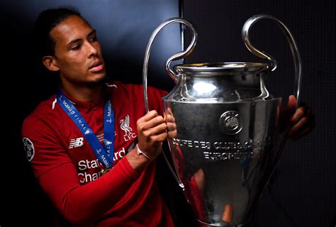 Virgil Van Dijk Holding Champions League Trophy