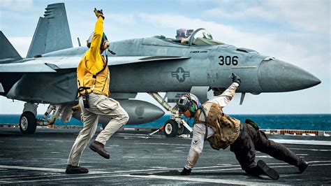 The Insane Hand Signals on an Aircraft Carrier's Flight Deck Explained ...