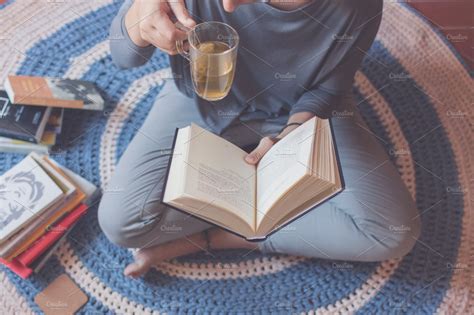 Reading and drinking tea | People Images ~ Creative Market