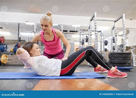 Middle-aged Woman Doing Sports Exercise in Fitness Center. Personal Gym ...