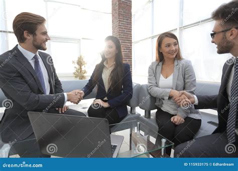 Business Associates Shaking Hands in Office. Stock Image - Image of group, partner: 115933175