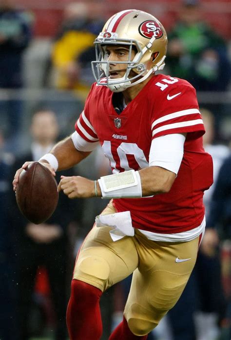 San Francisco 49ers quarterback Jimmy Garoppolo (10) rolls out looking ...