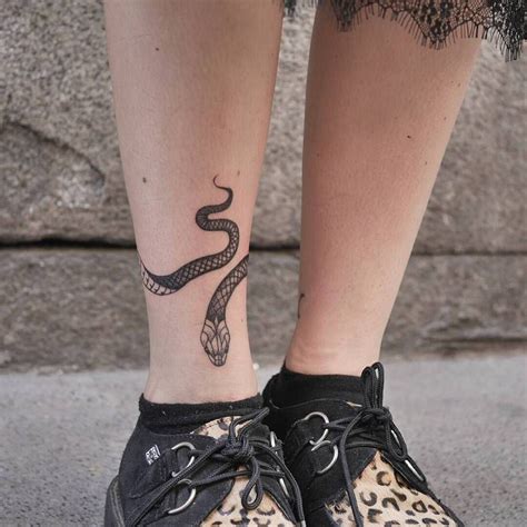 Snake tattoo on the right ankle - Tattoogrid.net