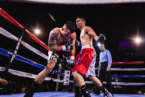 Low-Angle Photo of Two Men Fighting in Boxing Ring · Free Stock Photo