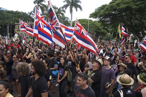 Thousands march to mark the overthrow of the Hawaiian monarchy