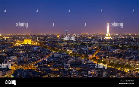 Paris City Skyline, Arc de Triomphe and the Eiffel Tower, viewed over rooftops, Paris, France ...