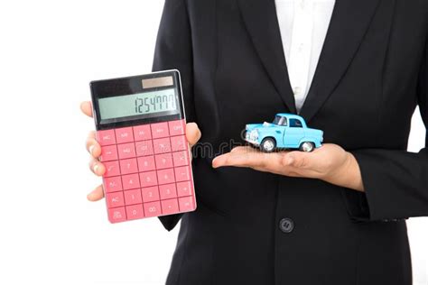 The Car Salesman Uses a Calculator To Show the Price of the Model Car in Hand Stock Image ...