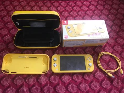 Nintendo Switch Lite (yellow) Preloved, Video Gaming, Video Game Consoles, Nintendo on Carousell