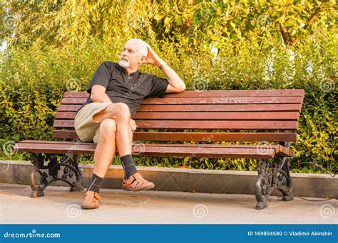 An Elderly Man is Sitting on a Bench Stock Photo - Image of people, summer: 169894580