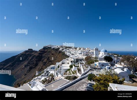 An aerial view of Santorini island surrounded by buildings Stock Photo ...