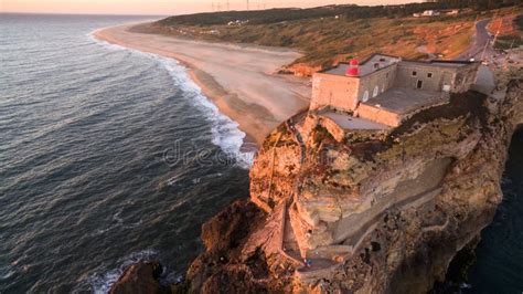 Aerial View of Ocean, North Beach and Nazare Lighthouse at Sunset, Portugal Stock Photo - Image ...