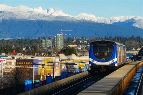 Download Richmond Canada Sky Trainwith Mountain Backdrop Wallpaper ...