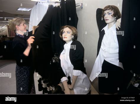 MARKS SPENCERS EMPLOYEE ARRANGING CLOTHES 1994 Stock Photo - Alamy