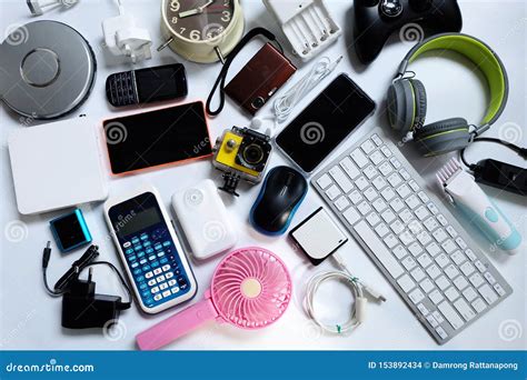 Many Used Modern Electronic Gadgets for daily Use on White Floor, Reuse and Recycle Concept ...