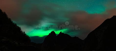 The Northern Lights Aurora Borealis Over Reine, Norway Stock Image ...