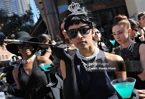 Audrey Hepburn look-alike in black party dresses with cigarette... News Photo - Getty Images