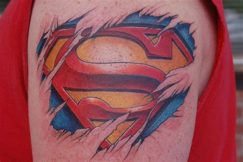 Colorful-Ripped-Skin-Superman-Logo-Tattoo-Design-For-Shoulder - Supportive Guru