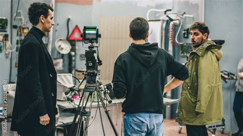 Behind the scene. Film crew filming movie scene in studio Stock Photo | Adobe Stock