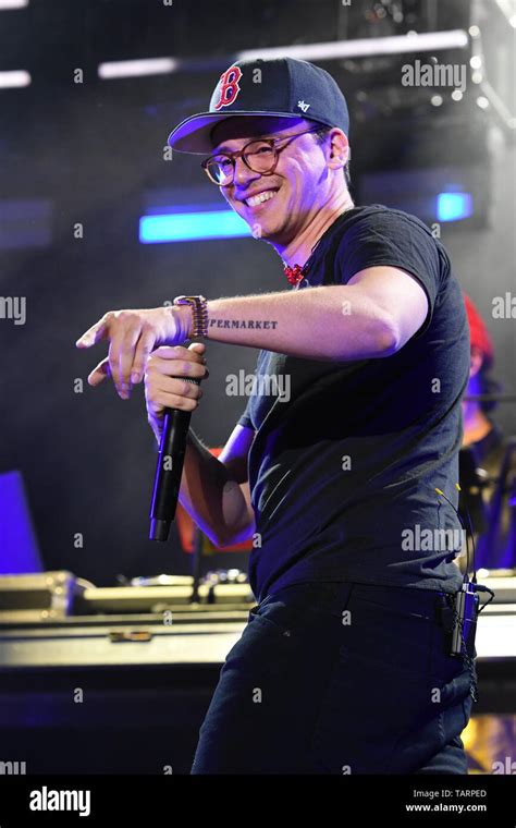 Rapper Logic is shown performing on stage during a live concert ...