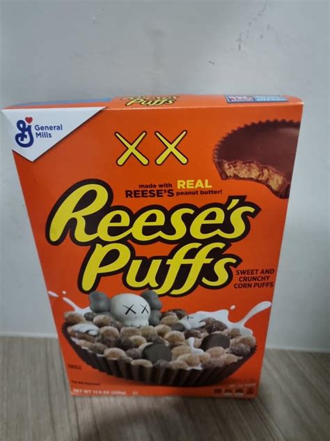 reese's puffs kaws edition, Food & Drinks, Packaged & Instant Food on Carousell