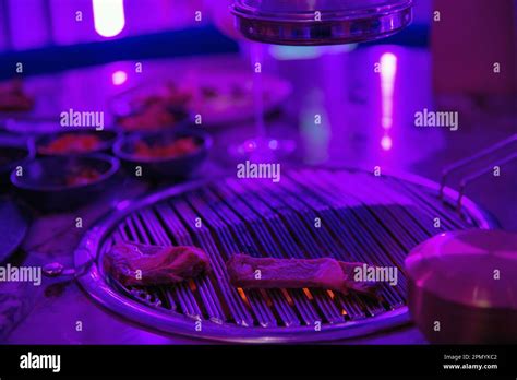 Sizzling Korean BBQ closeup in the restaurant Stock Photo - Alamy