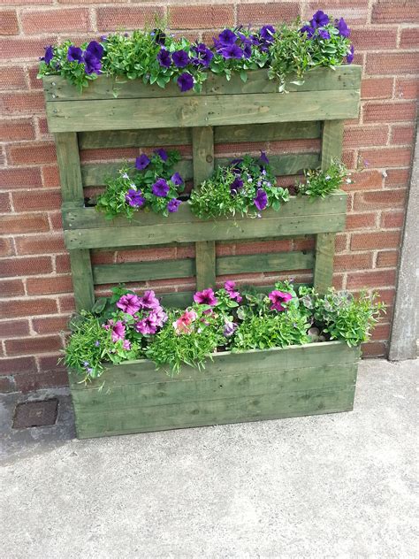 Pallet turned on its end with the blocks used as fixing points for slats from another pallet ...