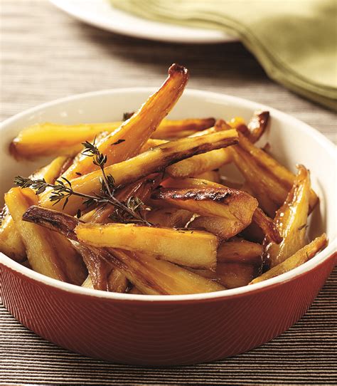 Honey-sweetened parsnips, roasted with fresh thyme and crushed garlic, are a nice change from ...