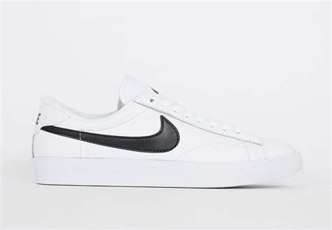 White Nike sneakers with black swoosh. | White shoes sneakers, White ...