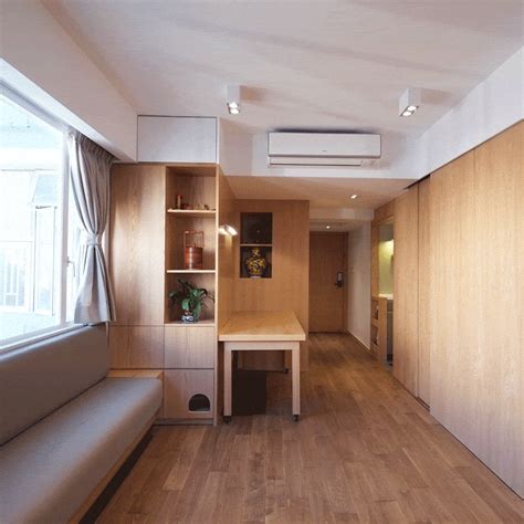 Adjustable furniture and sliding partitions maximise the limited plan of an apartment in Hong ...