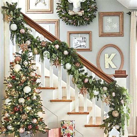 Stair Garland Stairway With Decorated Garland On Banister A Lighted Tree And Art On The ...