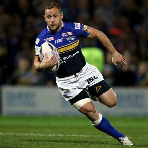 Emotional moment Rugby League star Rob Burrow is carried over Leeds Marathon finish line by ...