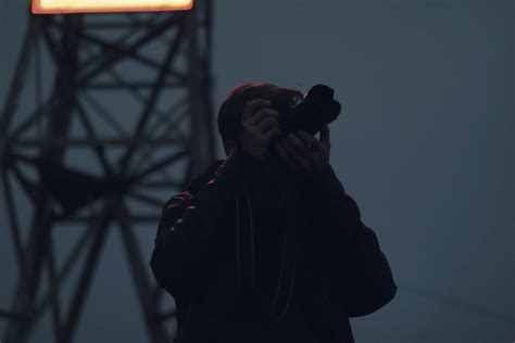 Silhouette Photography of Man Holding Dslr Camera · Free Stock Photo