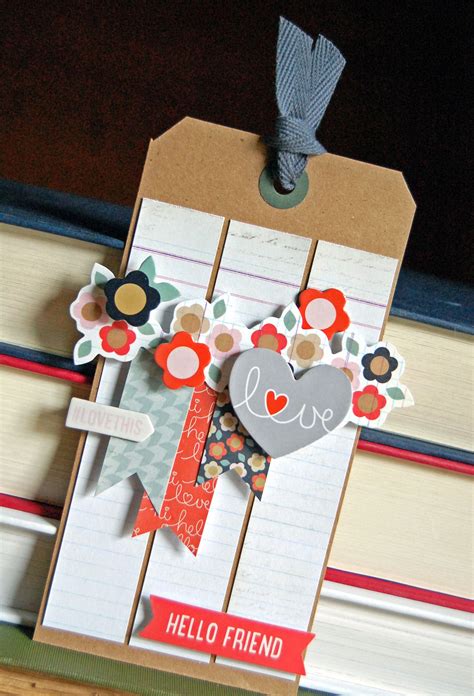 Love Tag - Scrapbook.com - Layer premade embellishments such as die cuts and layered stickers to ...