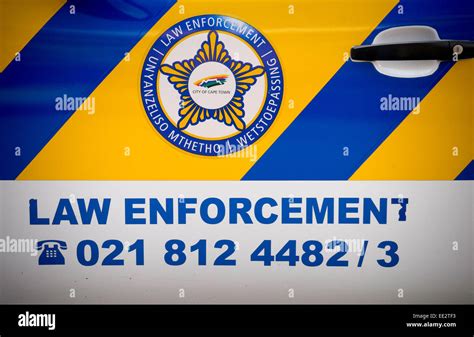 City of Cape Town logo and "Law Enforcement" sign on a vehicle in central Cape Town,. South ...