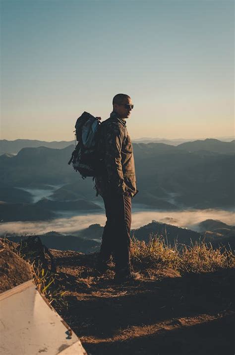 Person Standing on a Cliff · Free Stock Photo