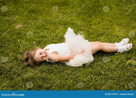 Cute Little Girl is Lying on Green Meadow Stock Image - Image of beautiful, green: 88179797