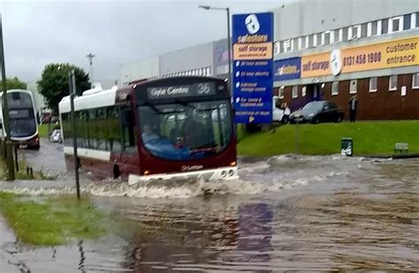 Edinburgh flooding chaos as tram evacuated and driver trapped on top of car - Daily Record