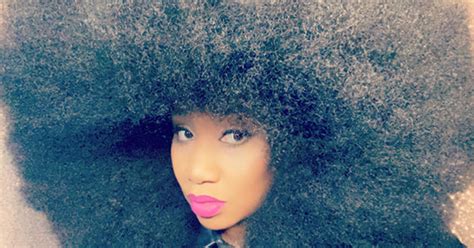 Woman smashes record for world's largest afro for the second time