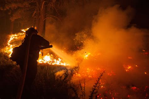 California wildfires burn dozens of homes, ski resort | Reuters