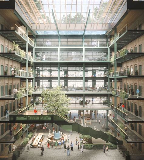 an atrium with people walking and sitting in it