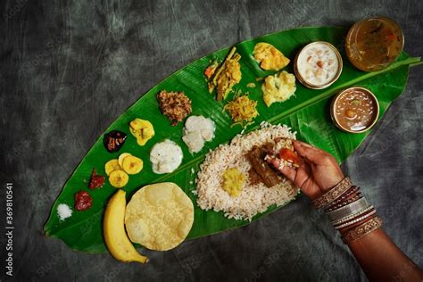 Kerala Onam Feast / Eating Ona-Sadya in banana leaf during the festival ...