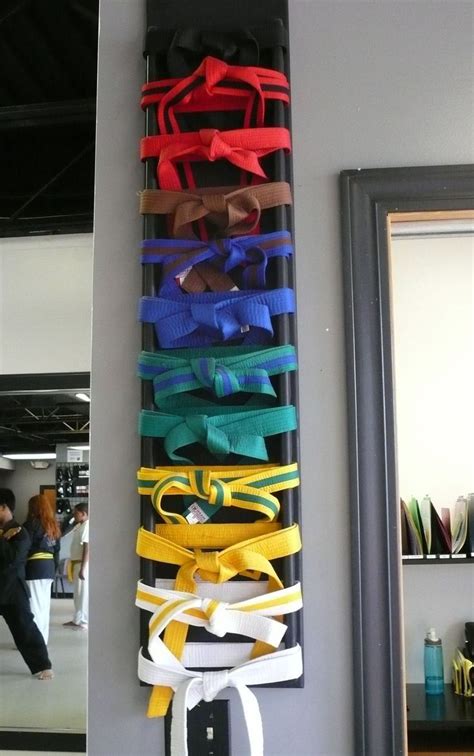 there are many different colored ribbons hanging on the wall