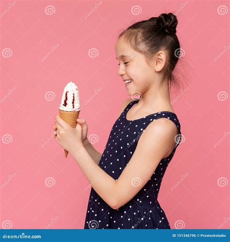 Happy Little Girl Looking at Sweet Ice Cream Cone Stock Photo - Image of treat, delicious: 151346796