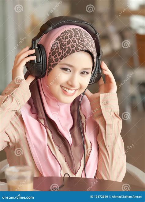 Young Muslim Women Wearing Head Phone Stock Photo - Image of expression, desire: 19372690