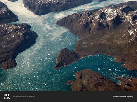 Aerial view of a few fjords in Southern Greenland. Taken from about 35,000 feet, we can see the ...